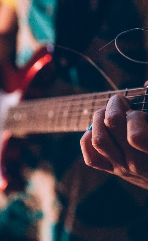 Closeup of a guitar player